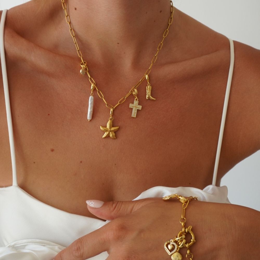charm halskæde med starfish vedhæng i guld